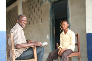 S.I. performance evaluation team member interviews a beneficiary of a youth program