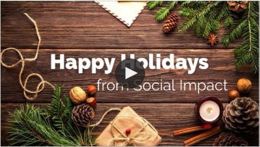 Holiday video screenshot saying Happy Holidays from Social Impact