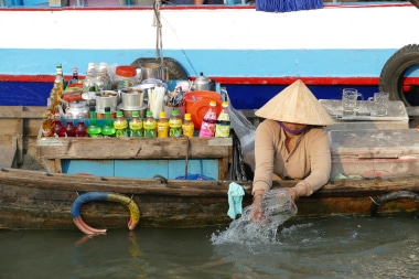 Woman in boat in Mekong.